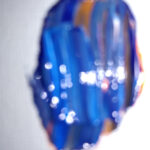 Blur #3 is an abstract photo of a tiny paint swab no more than 1/4" in size.