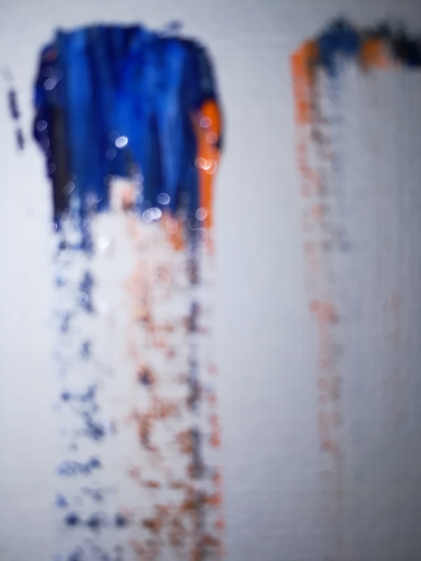 Blur #4 is an abstract photograph of two paint swabs no more than 1/4